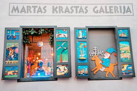 Riga, Latvia - December 26, 2014: Christmas installation and decoration on the windows of a Gallery in Riga in Latvia in winter.のeditorial素材