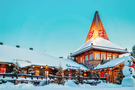 Rovaniemi, Finland - March 5, 2017: Santa Claus Office and Snowman at Santa Village with Christmas trees, Lapland. Finland, on Arctic Circle in winter.のeditorial素材