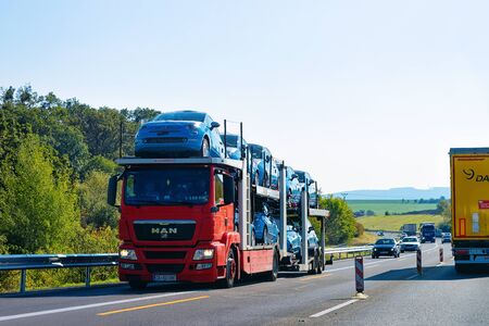 Maribor, Slovenia - September 19, 2018: Cars carrier truck on the asphalt road, Slovenia. Truck transporterのeditorial素材