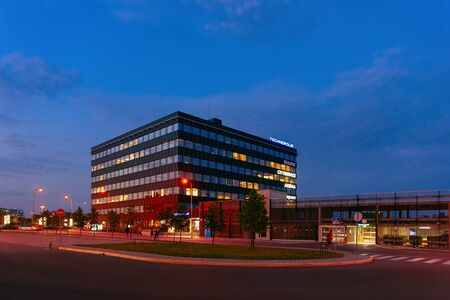 Vilnius, Lithuania - September 6, 2018: Modern business center building Technopolis concept. Street late at nightのeditorial素材