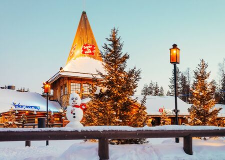 Rovaniemi, Finland - March 5, 2017: Santa Claus Office in Santa Village with Christmas trees in Lapland of Finland. Scandinavia, on Arctic Circle in winter. At nightのeditorial素材