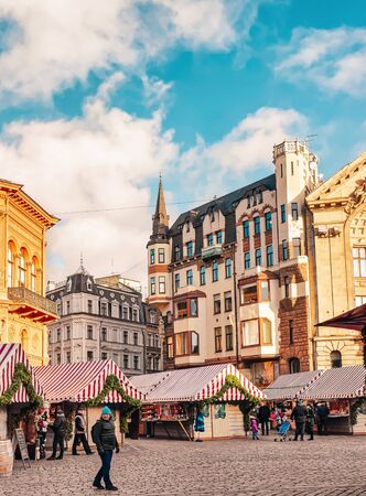 Riga, Latvia - December 26, 2015: People at Christmas market on Dome square in Riga in Latvia in winter.のeditorial素材
