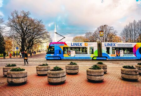 Riga, Latvia - December 26, 2015: Public tram in the street of Riga in Latvia in winter.のeditorial素材