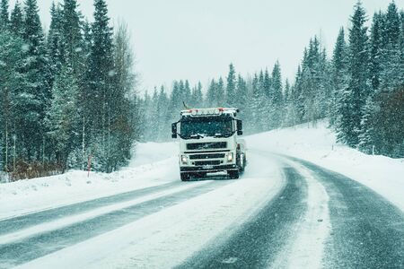 Rovaniemi, Finland - March 1, 2017: Truck on a Snowy winter Road in Finland in Lapland.のeditorial素材