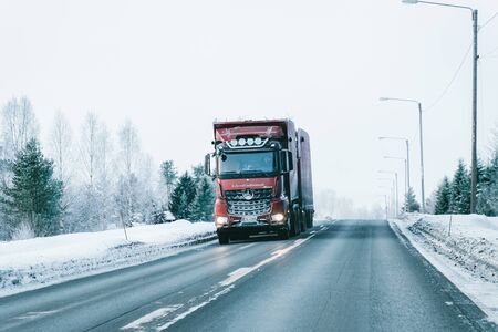 Rovaniemi, Finland - March 7, 2017: Truck at the Snowy winter Road of Finland, Lapland.のeditorial素材