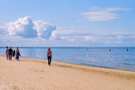 Jurmala, Latvia - September 2, 2018: People relaxing at Sandy beach on the Baltic Sea in Jurmala in Latvia.のeditorial素材
