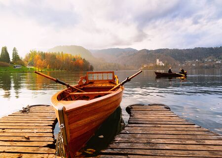 Bled, Slovenia - November 10, 2018: Boat in Bled Lake in Slovenia. Travel in Europe. At sunsetのeditorial素材