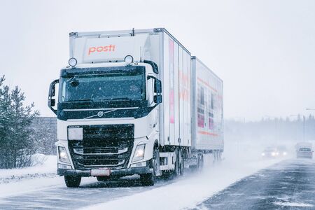 Rovaniemi, Finland - March 1, 2017: Truck in the Snowy winter Road in Finland of Lapland.のeditorial素材
