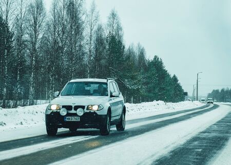 Rovaniemi, Finland - March 1, 2017: Car on the road at snowy winter Lapland, Rovaniemi, Finlandのeditorial素材