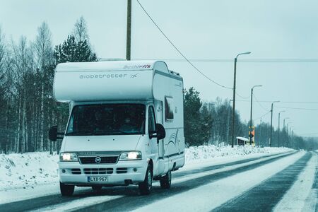Rovaniemi, Finland - March 1, 2017: Caravan RV in road at winter Rovaniemi, in Lapland, Finland. At snowfall, Europeのeditorial素材