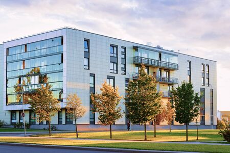 Vilnius, Lithuania - September 29, 2018: Modern apartment residential building and the street on the background.のeditorial素材