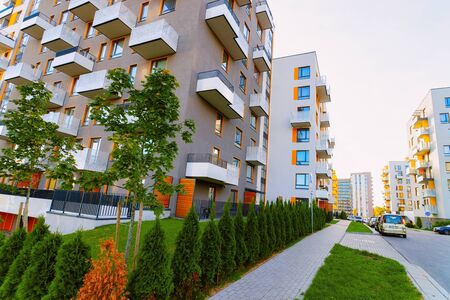 Vilnius, Lithuania - October 8, 2018: Apartment house residential building complex real estate concept. Street car parking. During sunsetのeditorial素材