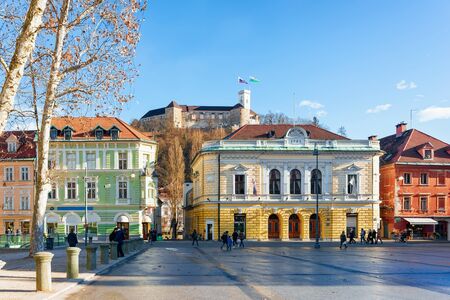 Ljubljana, Slovenia - January 14, 2019: People in Congress Square and cityscape of Ljubljana old town street, Slovenia. Tourists in beautiful Slovenian city view in winter. Castle on backgroundのeditorial素材