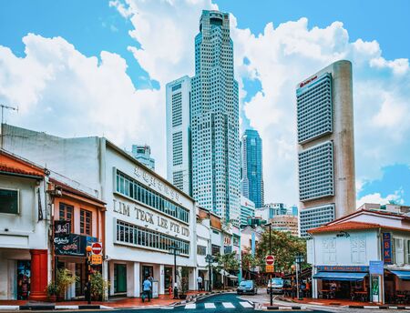 Singapore, Singapore - February 29, 2016: Shophouses at Boat Quay District and UOB Plaza of Downtown Core and Singapore skyline. United Overseas Bank is located in the Plaza.のeditorial素材