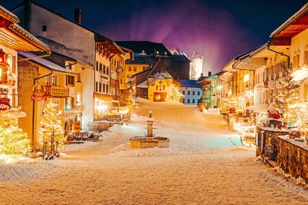 Gruyeres, Switzerland - January 1, 2015: Christmas Gruyeres town village of Switzerland, in winter at nightのeditorial素材