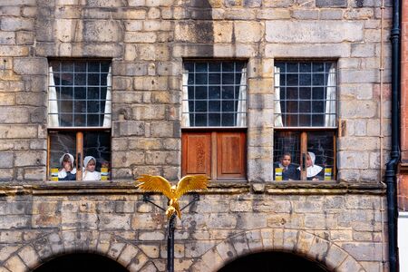 Edinburgh, UK - May 11, 2011: Pupils looking at the windows of school in Edinburgh in Scotland in the UK.のeditorial素材