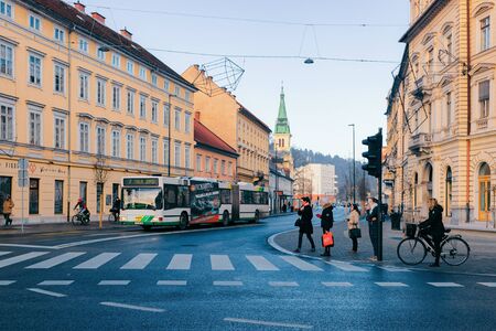 Ljubljana, Slovenia - January 14, 2019: Pedestrians on Street and cityscape of Ljubljana old town, Slovenia, Europe. People in Slovenian city view in winter. Urban green capital. Travelのeditorial素材