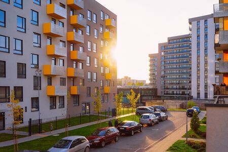 Vilnius, Lithuania - October 8, 2018: Apartment home, house residential building complex real estate concept. Street car parking. During the sunsetのeditorial素材