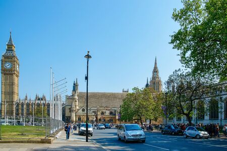 London, UK - April 30, 2011: Car traffic on busy road at Big Ben of Westminster Palace in London old...
