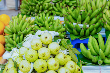 Green guava and banana fruit as Exotic tropical asian food in Hanoi in Vietnam. Street market with...