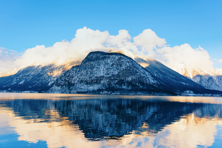 Hallstatt and Alps mountains near Salzburg at Austria, Europe. Winter in Salzkammergut. Travel to Austrian city with lake at Christmas. Alpine Land with snow. View on Villageの写真素材