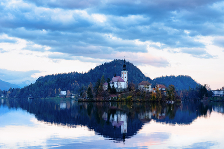 Beautiful landscape of Bled Lake and Church in Slovenia. Travel in Europe at sunsetの写真素材