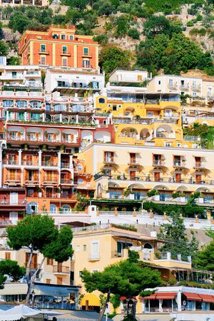 Citiscape with villa houses at Positano town on Amalfi Coast and Tyrrhenian Sea in Italy in summer. View of beautiful Mediterranean architecture near Sorrento.の写真素材
