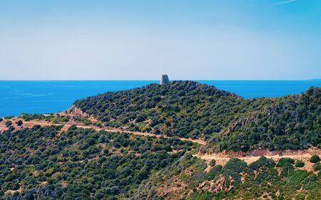Landscape with Old tower ruins at Chia beach in the Mediterranean Sea in Villasimius in Sardinia Island in Italy in summer. View on Sardinian nature in Sardegna.の写真素材