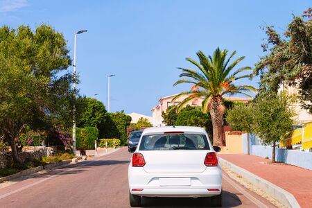 Car with driving in the highway road at Capo Testa in Santa Teresa Gallura at the Mediterranean Sea on Sardinia Island in Summer Italy. Holiday adventure in mountains.の写真素材