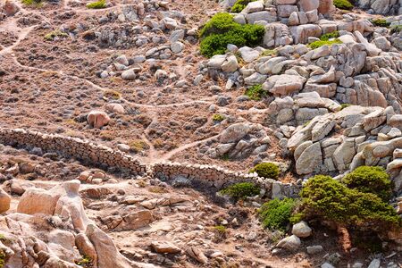 Stones and rocks at Capo Testa in Santa Teresa Gallura province on Sardinia island in Italy. Nature, mountains and green plants.の写真素材