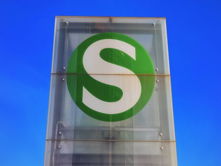 Berlin, Germany - December 13, 2017: Green sign of S bahn of rapid transit railway system Deutsche Bahn in Berlin Mitte in City centre.のeditorial素材