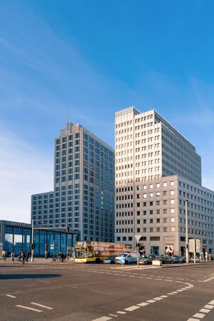 Berlin, Germany - December 13, 2017: Road and car traffic and people on Bahnhof station with modern building architecture in Potsdamer Platz Square in Berlin German City centre in Europeのeditorial素材