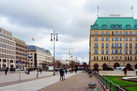 Berlin, Germany - December 8, 2017: Cityscape with people on Unter den Linden street in German City centre in Berlin with Fernsehturm tv tower of Germany in Europe. Building architecture.のeditorial素材