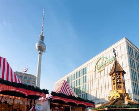 Berlin, Germany - December 10, 2017: People at Christmas market in Germany in Europe in winter. At Alexanderplatz. Fernsehturm tv tower on backgroundのeditorial素材