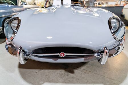 Berlin, Germany - December 11, 2017: Radiator grill and headlights of white vintage classic Jaguar...