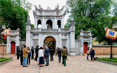 Hanoi, Vietnam - February 24, 2016: People at Entrance gate at Temple of Literature in Hanoi in Southeast Asia, Vietnam. Temple of Confucius in Vietnamese capital. Street view in park at Asian Ha Noiのeditorial素材