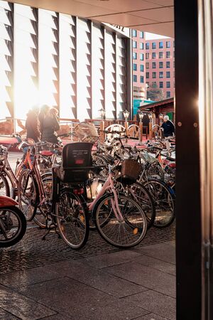 Berlin, Germany - December 13, 2017: Bicycles parked near Potsdamer Platz Bahnhof station in German City centre in Berlin in Germany in Europe. Building architecture. Details of exterior.のeditorial素材