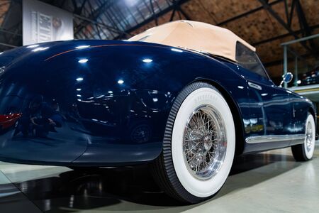 Berlin, Germany - December 11, 2017: Wheel of blue vintage classic Alfa Romeo convertible cabriolet...