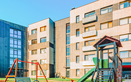 EU Complex of new apartment residential buildings with children playground as other outdoor facilities. Tonedのeditorial素材