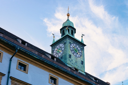 Clock tower of Styrian Armoury, or Landeszeughaus on Herrengasse Street in Downtown and Old city of Graz in Austria, in Styria in Europe. Blue sky on the backgroundのeditorial素材
