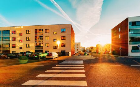 Modern residential apartment and flat building exterior with outdoor. New luxury house and home complex and street with road. City Real estate property and condo architecture. Empty backgroundの写真素材