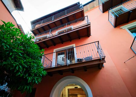 Balconies of Colorful Modern residential apartment and flat building exterior near Garda lake of Trentino of Italy. New luxury house and home complex. City Real estate property and condo architecture.の写真素材