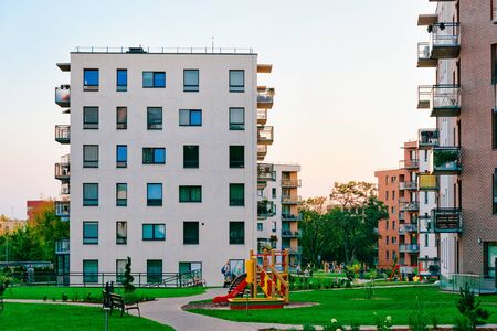New residential apartment flat house buildings with children playground