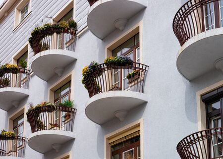 Balcony with flower pots in house building Celje Sloveniaの写真素材