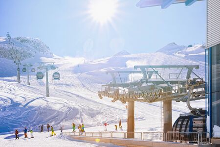 Cable cars and skiers skiing Hintertux Glacier Austria
