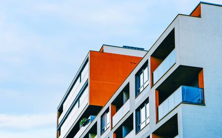 Apartment in residential building exterior. Housing structure at blue modern house of Europe. Rental...