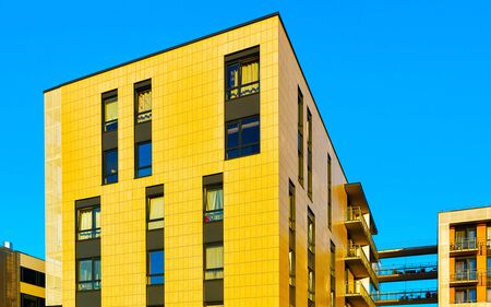 Apartment in residential building exterior. Housing structure at blue modern house of Europe. Rental...