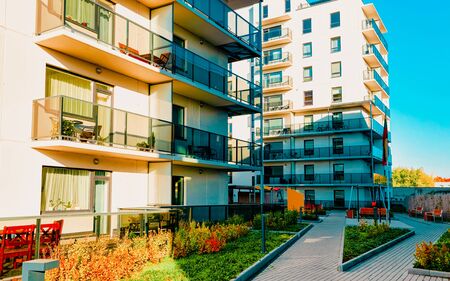 Apartment in residential building exterior. Housing structure at blue modern house of Europe. Rental home in city district on summer. Architecture for business property investment, Vilnius, Lithuania.の写真素材