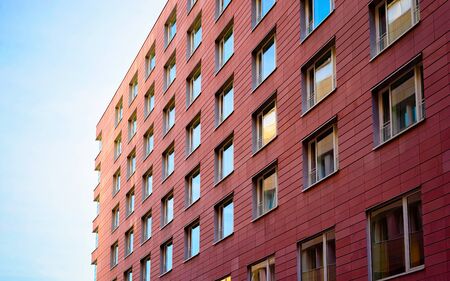 Apartment in residential building exterior. Housing structure at blue modern house of Europe. Rental home in city district on summer. Architecture for business property investment in Berlin, Germany.の写真素材
