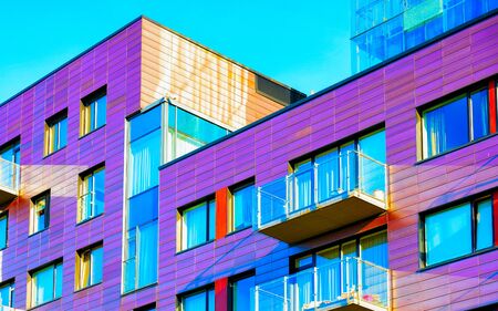 Apartment in residential building exterior. Housing structure at blue modern house of Europe. Rental home in city district on summer. Architecture for business property investment, Vilnius, Lithuania.の写真素材
